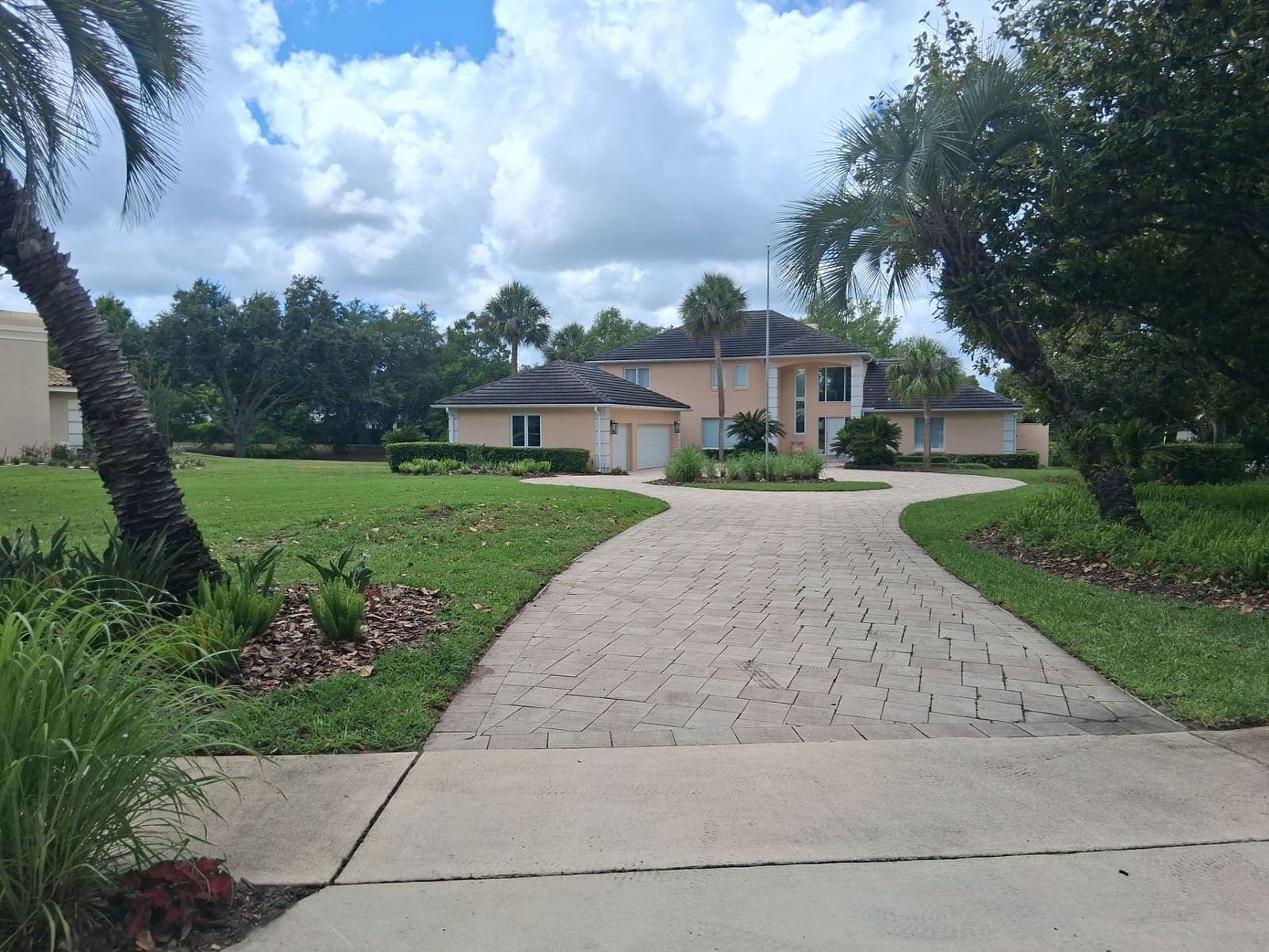 Commercial office landscape with paver entrance in Central Florida — Firsthand Lawn and Landscape