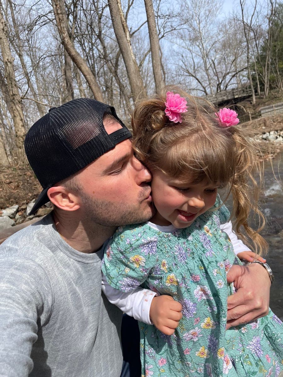 Ryan H., founder of Firsthand Lawn and Landscape, with his daughter
